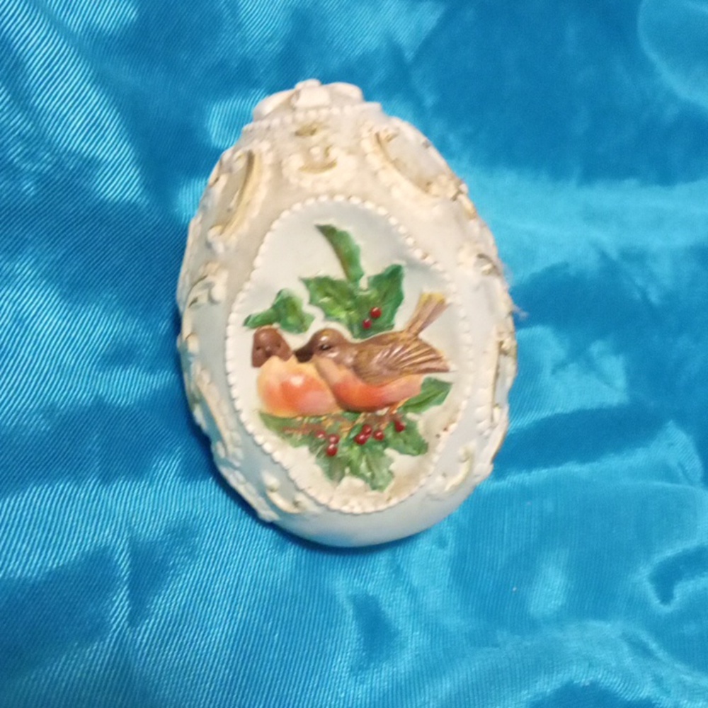 Antique egg decor with birds on it